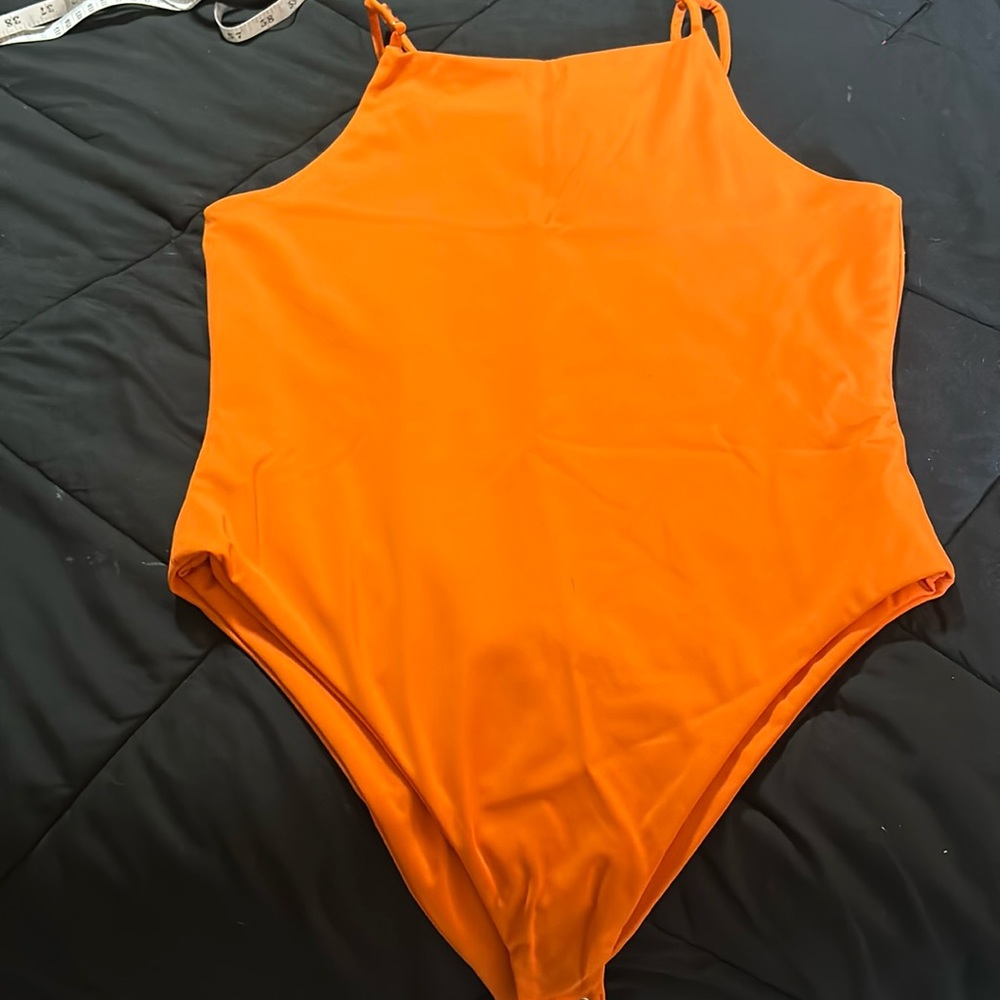Bright orange tank top one piece. Onesie